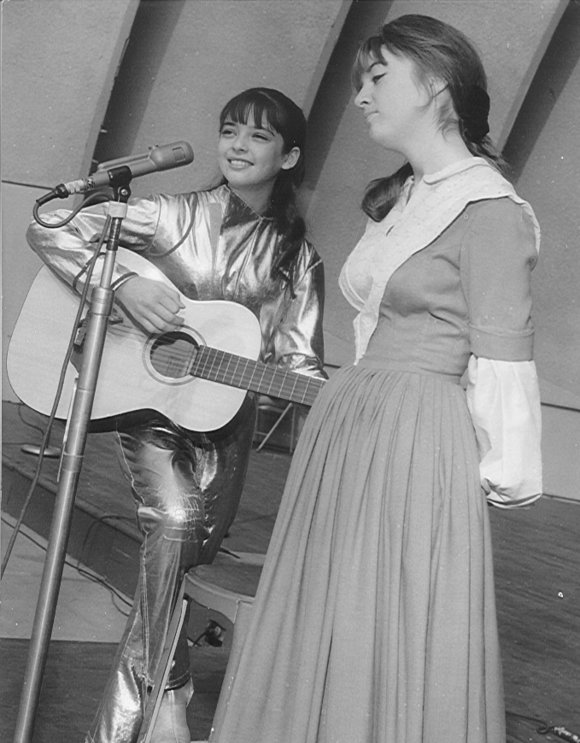 Singing with my sister Angela at the Hollywood Bowl in costume. My sister was on the series Lost In Space at the time. ..